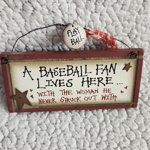 MLB A Baseball fan lives here with a woman. He never struck out with. De…